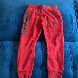 Red Nike jogging pants